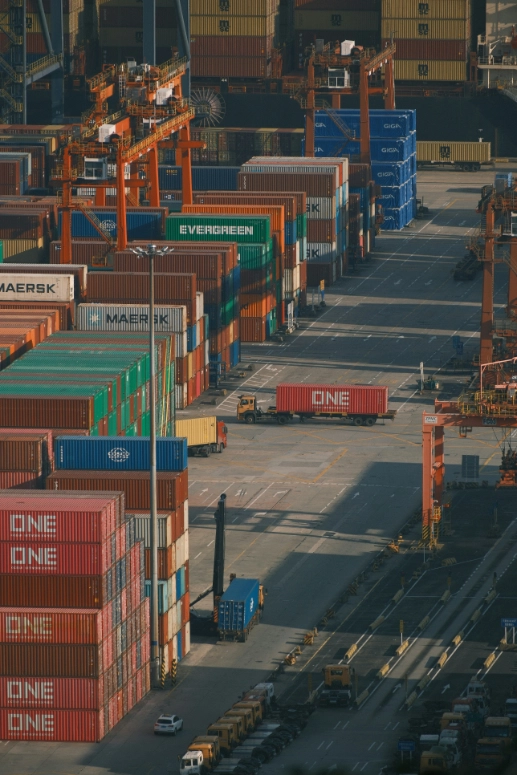Freight containers arranged at a cargo terminal as part of the logistics and transportation network.